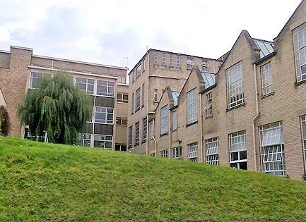Courtyard with grass and building behind