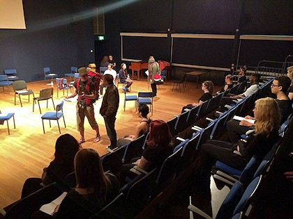 Drama students work in the main hall - curtains pulled and lights on