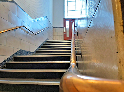 stairs and bronze handrail