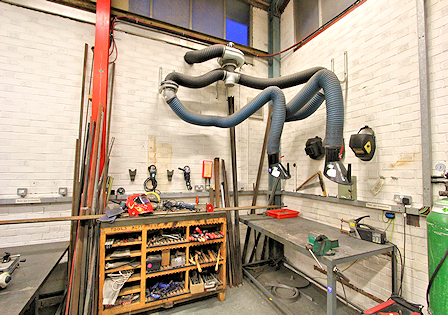 Photo of a machine for extracting air over two work benches